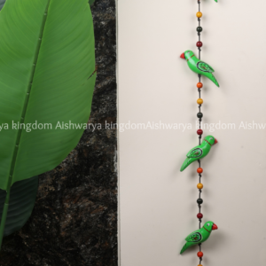 Wooden bird wall hanging hand painted green and orange with beads and bell
