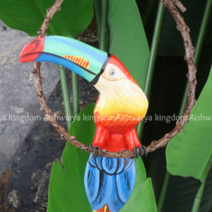 Wooden toucan bird figurine hand carved colorful beak on branch
