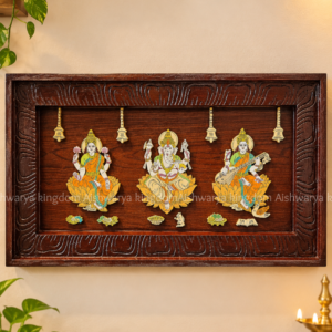 Wooden Lakshmi Ganesha Saraswathi wall panel with three deity figures and carved wooden frame