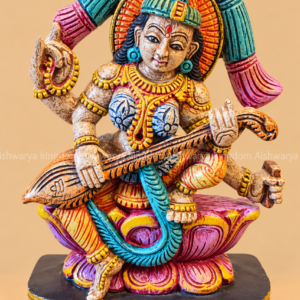 Wooden Saraswati idol with veena sitting on lotus hand painted