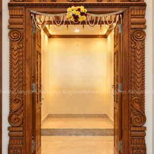 Wooden pooja room door with carved Gajalakshmi frame