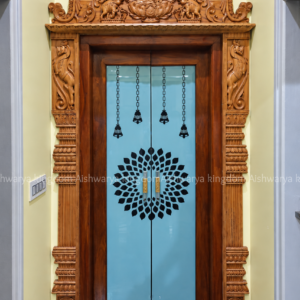 Wooden pooja room door with carved Gajalakshmi frame and temple top